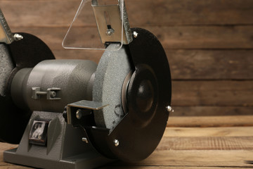 Knife sharpener on wooden background