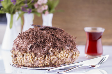Whole Round Cake and Slice on Wood Table