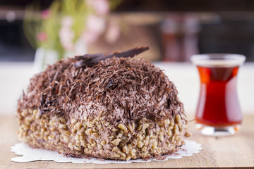 Whole Round Cake and Slice on Wood Table