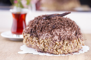 Whole Round Cake and Slice on Wood Table