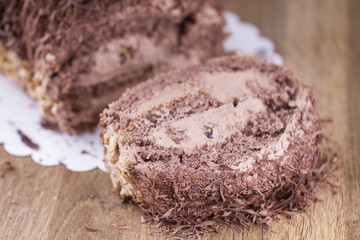 Whole Round Cake and Slice on Wood Table