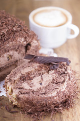 Whole Round Cake and Slice on Wood Table