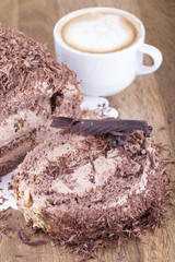 Whole Round Cake and Slice on Wood Table