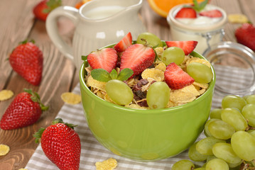 Natural muesli with strawberries and grapes
