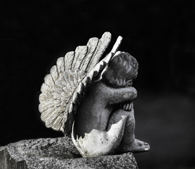 Child Angel statue on gravestone