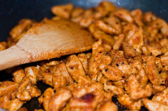 Chicken curry nuggets on a frying pan for kebab or gyros