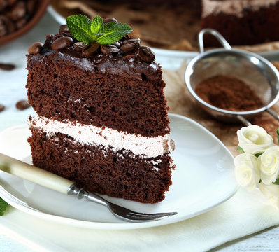 Delicious chocolate cake on table close-up