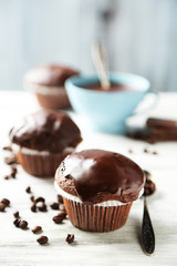 Tasty homemade chocolate muffins and cup of coffee