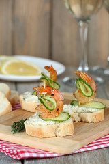Appetizer canape with shrimp and cucumber on table close up
