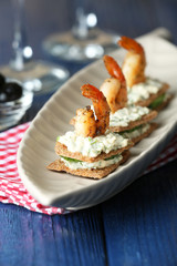 Appetizer canape with shrimp and cucumber
