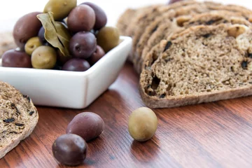 Foto op Plexiglas fresh baked olive bread slices © Casey E Martin