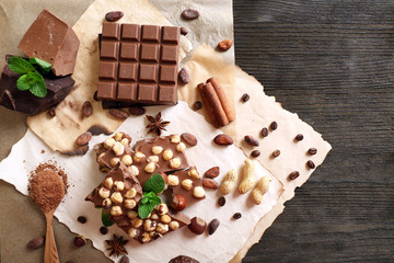 Still life with set of chocolate on table, top view