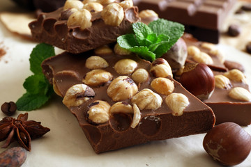 Chocolate with nuts, spices and mint, closeup