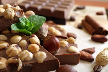 Chocolate with nuts, spices and mint, closeup