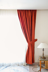 Red curtains in a hotel room