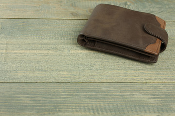 three male purse on wood background