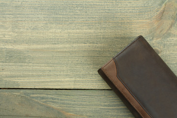 three male purse on wood background