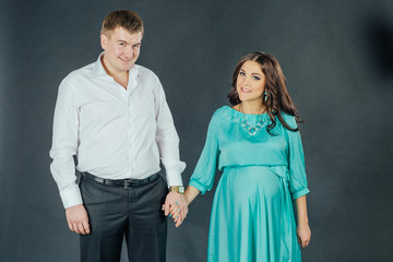 young couple standing and looking at the camera