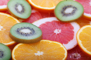 Orange and grapefruit rings as background