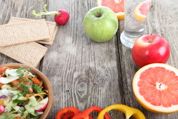 Healthy food for diet on a wooden table .