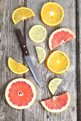 Fototapeta na wymiar Citrus fruits and a knife