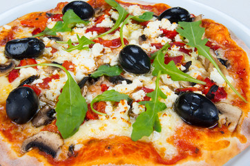 Pizza with cheese, mushrooms and olives.