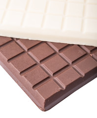 White and dark brown chocolate bars over white background