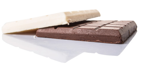 White and dark brown chocolate bars over white background