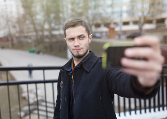 beautiful stylish brutal hipster guy selfie