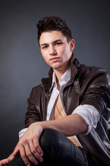 Healthy muscular young man on grey background