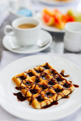 Delicious waffles with coffee