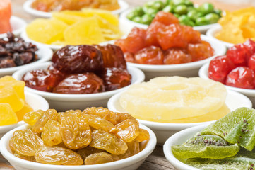 Close-up grape and  dried fruits in a ceramic bowl