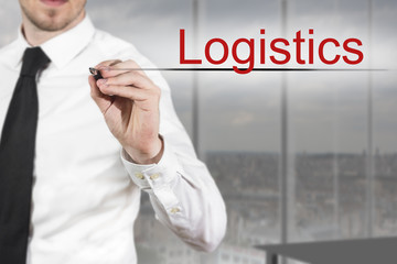 businessman writing logistics in office
