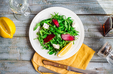 green salad with arugula beet and goat cheese, lemon, organic fo