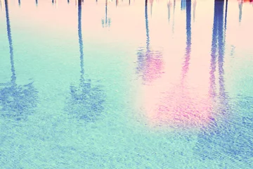Rolgordijnen pool with reflections of palm trees © neirfy