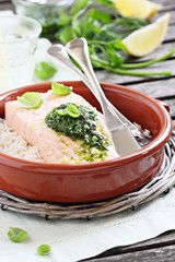 Steamed salmon with pesto and rice garnish.Selective focus.