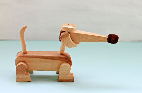Handmade wooden toy of dachshund dog
