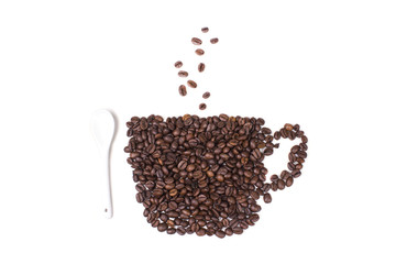 cup of natural coffee beans with small white spoon
