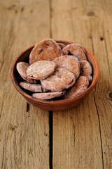 Homemade rye cookies with berries in clay bowl