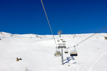 Fototapeta na wymiar Ski chairlifts