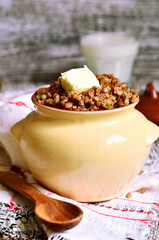Boiled buckwheat with piece of butter.