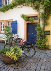 Fototapeta na wymiar Bicycles parked near small house in european town