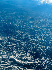 View from window of airplane flying over Norway Scandinavia.