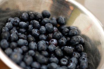 Blueberries in a bowl. Shallow dof, focus in the middle.