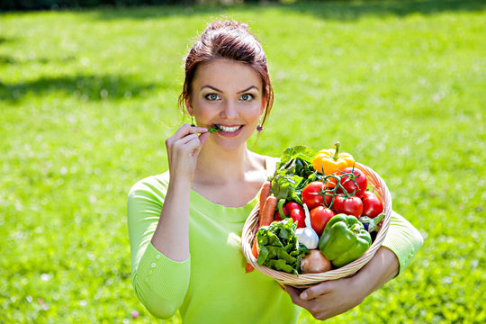 Young Girl With Basket Full Of Healthy Food