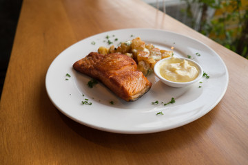 Salmon steak with baked potato