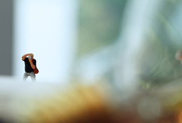 Creative idea concept - miniature photographer with vintage ligh