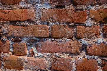 Detail  close up of an old uneven brick wall.