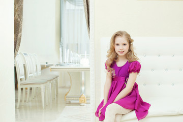 Image of smiling cute girl in smart purple dress