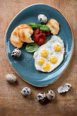 Breakfast fried eggs with toasted bread, above view, studio shot